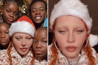 64岁麦当娜显怪异！与黑人养子自拍，非洲度假晒床照，过度整容