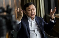 泰国警方确认他信回国时间，但能否实现取决于两件事