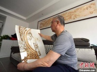 长春“铁笔”画师：以“火”为墨绘人生